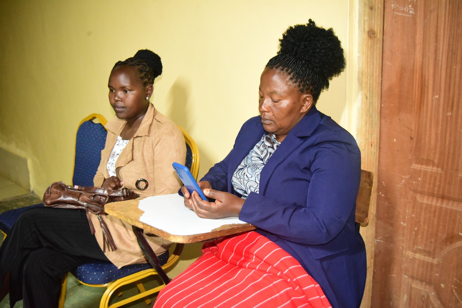 Staff member assisting a student