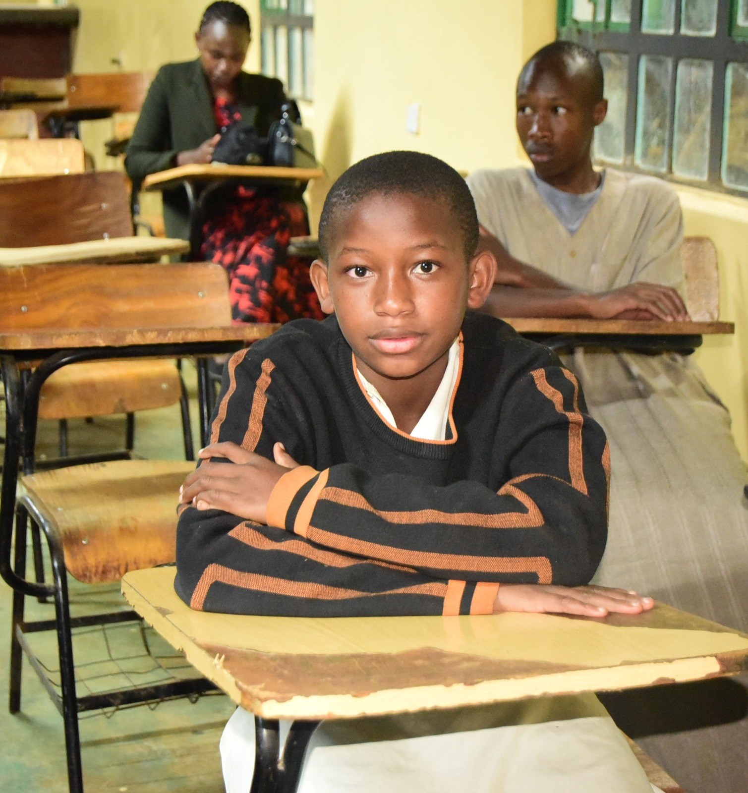 Student seated at a desk in class